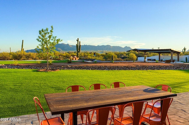 view of yard with a mountain view and a patio area