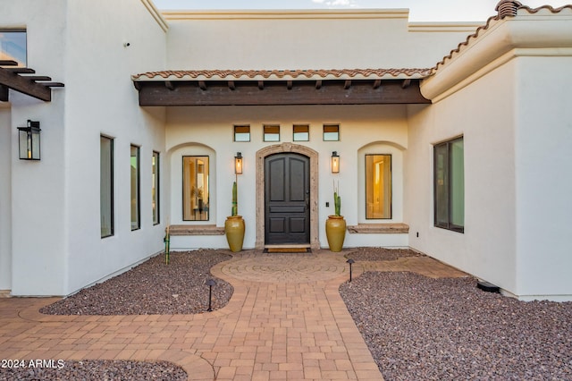 entrance to property with a patio area