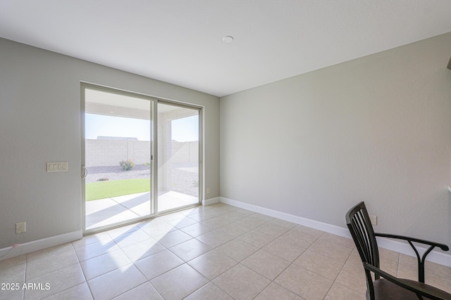 unfurnished office featuring light tile patterned floors