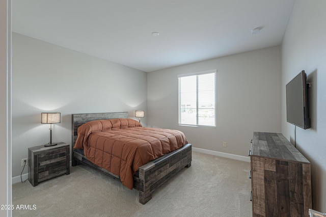 bedroom featuring light carpet