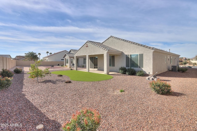 back of property featuring cooling unit and a patio area