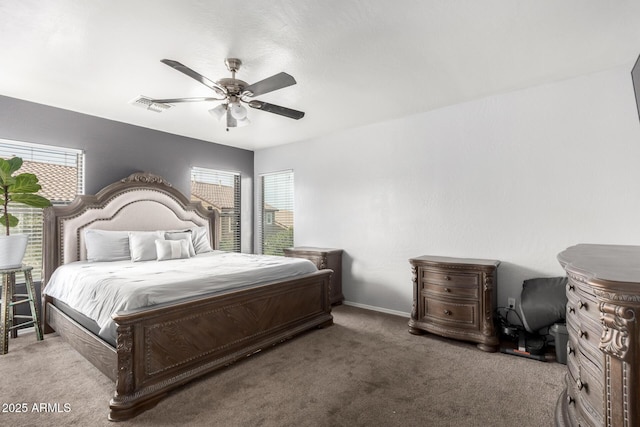 bedroom featuring multiple windows, carpet floors, and ceiling fan