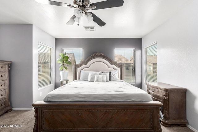 bedroom featuring ceiling fan and light colored carpet