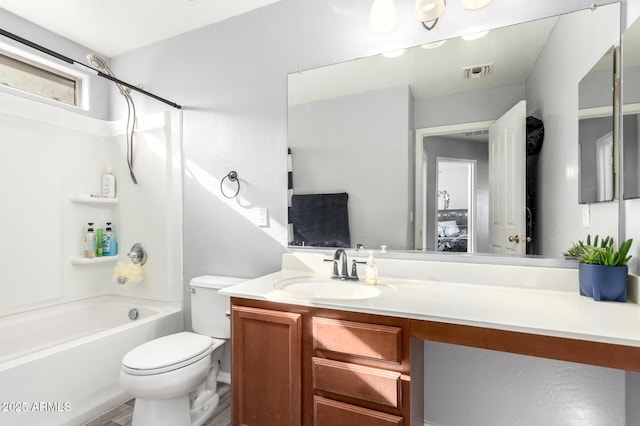 full bathroom with shower / bathing tub combination, vanity, and toilet