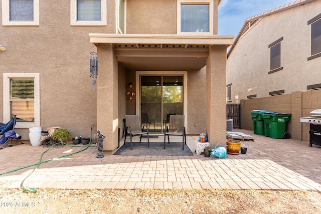 rear view of property featuring a patio area