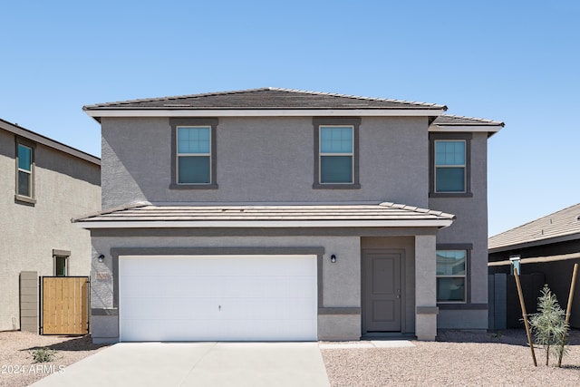 front of property with a garage