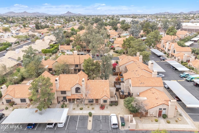 birds eye view of property with a residential view and a mountain view