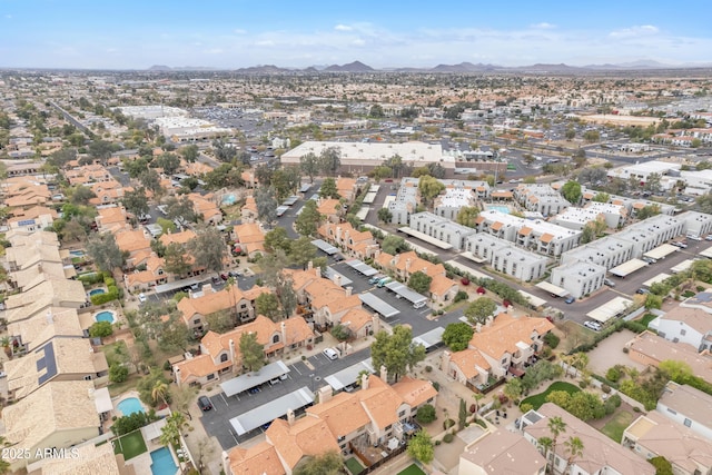 birds eye view of property with a mountain view