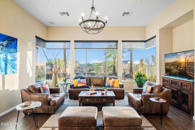 sunroom featuring an inviting chandelier