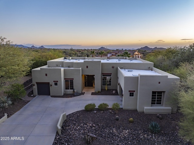 southwest-style home with a garage