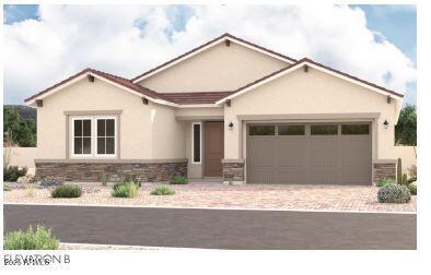 ranch-style home with stone siding, driveway, an attached garage, and stucco siding