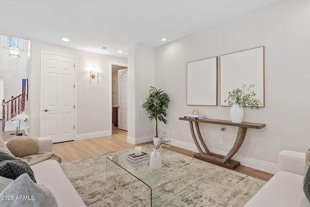 living room with stairway, baseboards, wood finished floors, and recessed lighting