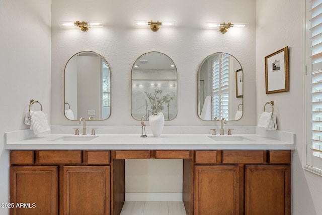 bathroom featuring double vanity and a sink