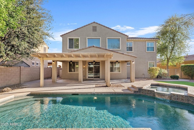 back of house featuring a patio, a fenced backyard, a ceiling fan, and stucco siding