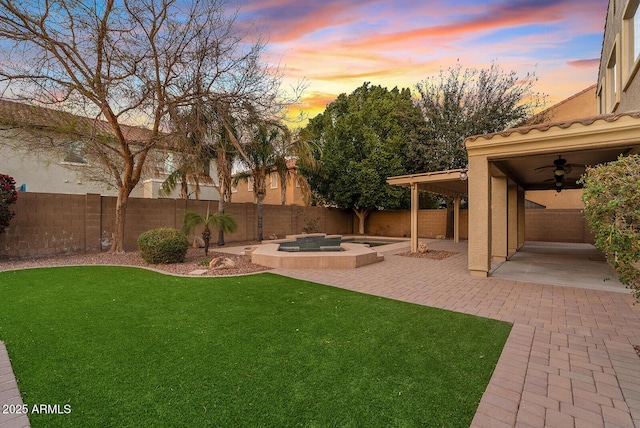 view of yard with a patio area and a fenced backyard