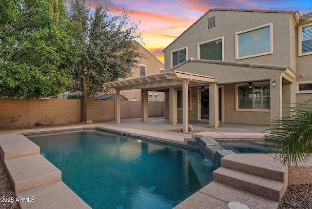 view of pool featuring a patio area, a fenced backyard, a pool with connected hot tub, and a pergola