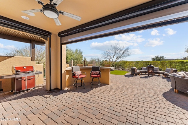 view of patio featuring outdoor lounge area, an outdoor bar, and ceiling fan