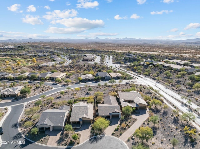 birds eye view of property with a mountain view