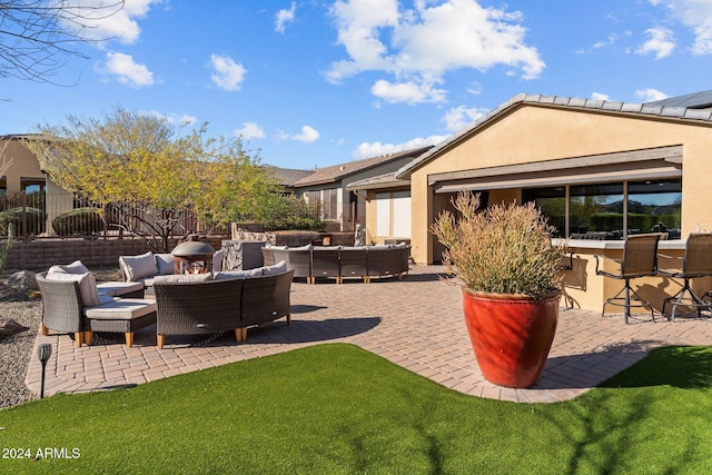 view of patio / terrace with an outdoor living space and a bar