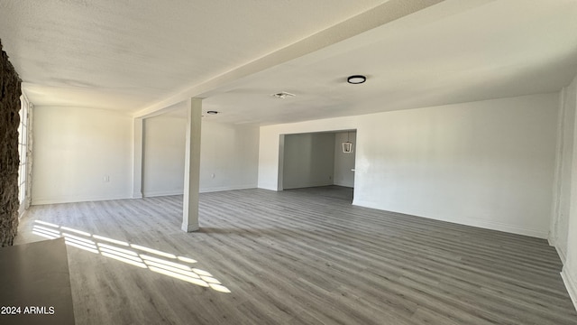 121 E Monte Way, Phoenix, AZ 85042 - unfurnished living room featuring wood finished floors and baseboards