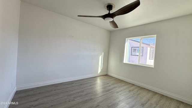121 E Monte Way, Phoenix, AZ 85042 - spare room featuring wood finished floors, baseboards, and a ceiling fan