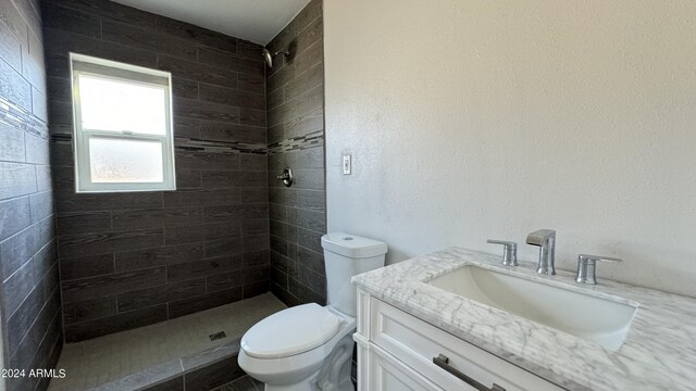 121 E Monte Way, Phoenix, AZ 85042 - full bath featuring vanity, tiled shower, and toilet