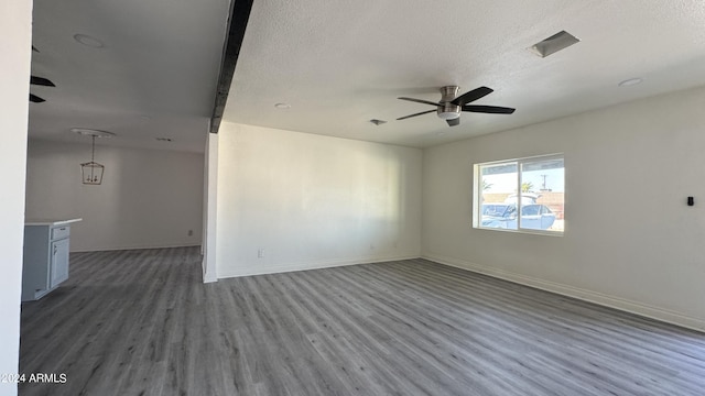 121 E Monte Way, Phoenix, AZ 85042 - unfurnished room with ceiling fan, wood finished floors, a textured ceiling, and baseboards