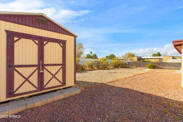 view of shed with fence