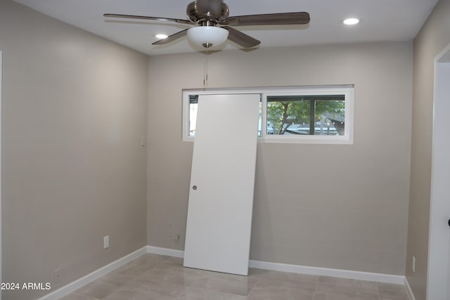 spare room with ceiling fan