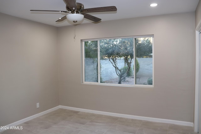 spare room with ceiling fan