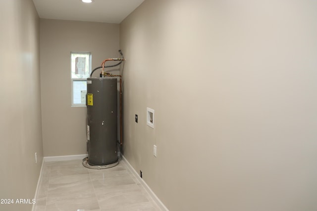 utility room featuring electric water heater