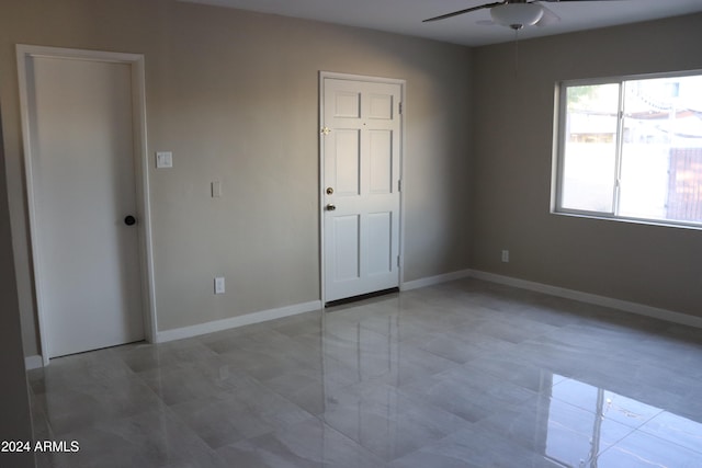 unfurnished bedroom featuring ceiling fan