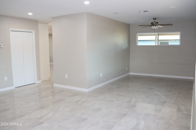 empty room featuring ceiling fan