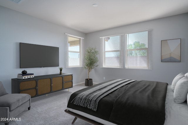 bedroom with light colored carpet