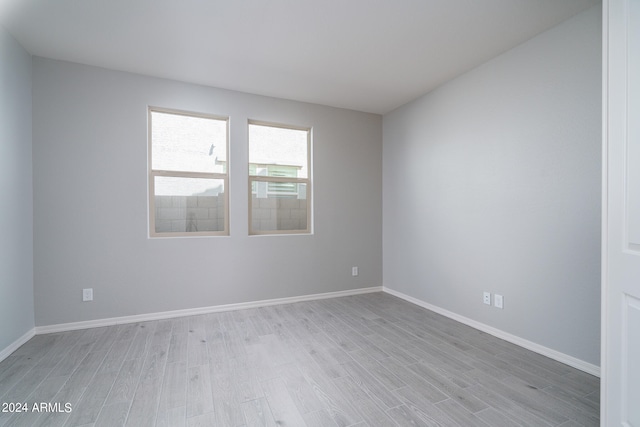 spare room with light wood-type flooring