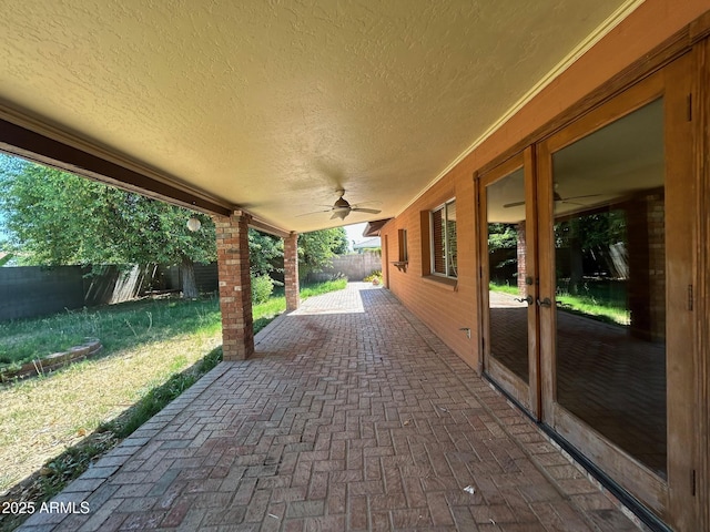 3740 E Mercer Ln, Phoenix, AZ 85028 - fenced backyard with a ceiling fan and a patio area
