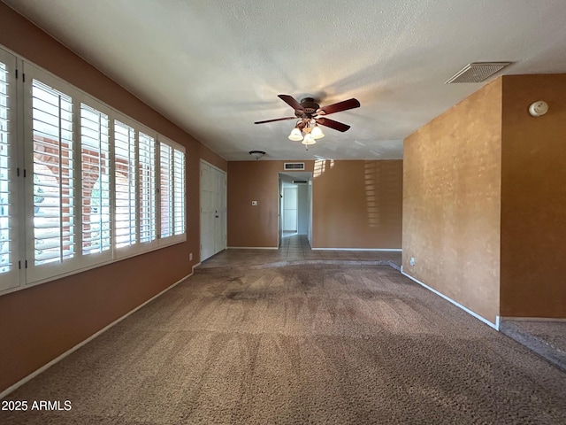 3740 E Mercer Ln, Phoenix, AZ 85028 - empty room featuring ceiling fan, carpet flooring, healthy amount of natural light, and a smoke detector