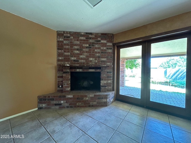 3740 E Mercer Ln, Phoenix, AZ 85028 - unfurnished living room with tile patterned floors, a textured ceiling, a fireplace, and french doors