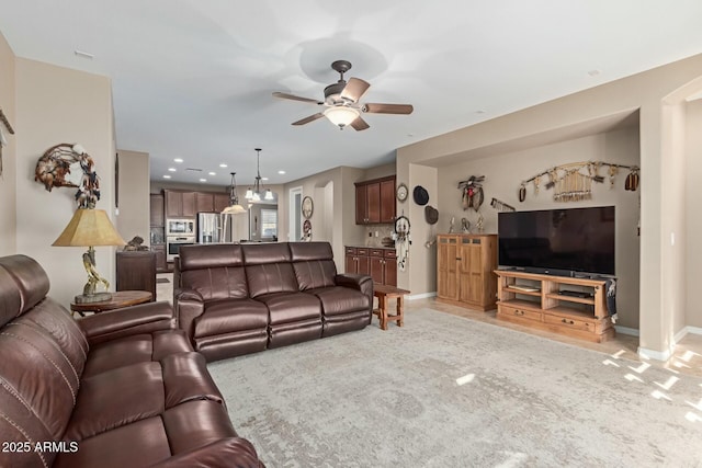 living room featuring ceiling fan