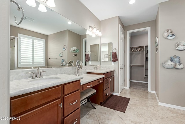 bathroom with tile patterned floors and vanity