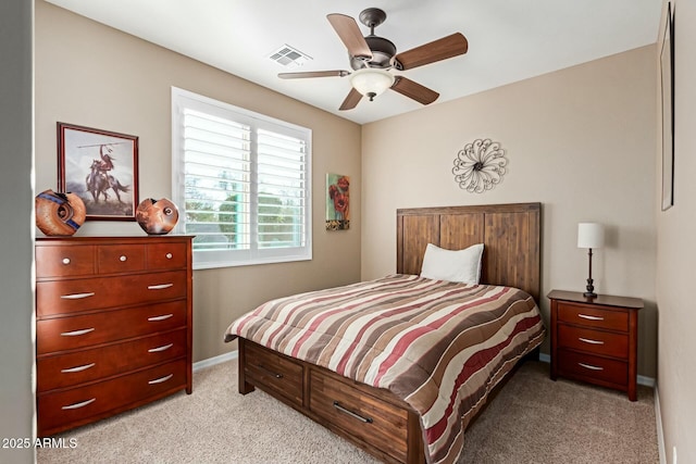 bedroom featuring ceiling fan and light carpet