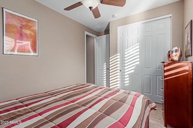 bedroom with carpet, a closet, and ceiling fan