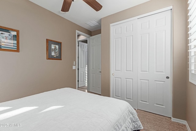 carpeted bedroom featuring a closet and ceiling fan