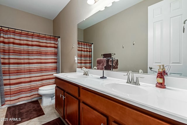 bathroom with toilet, vanity, tile patterned floors, and walk in shower