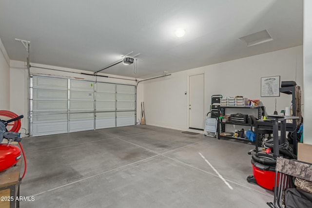 garage featuring a garage door opener