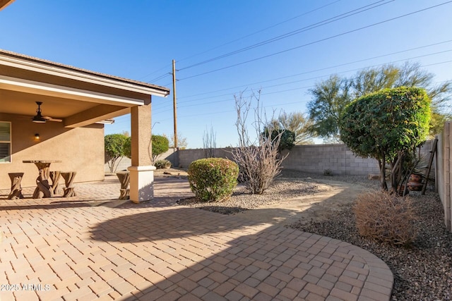 view of patio featuring ceiling fan