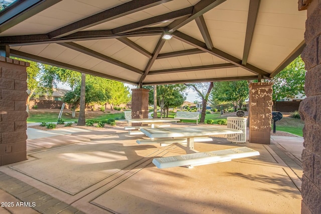 surrounding community with a gazebo and a patio area