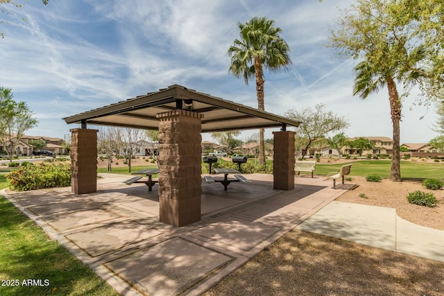 view of community with a gazebo, a yard, and a patio