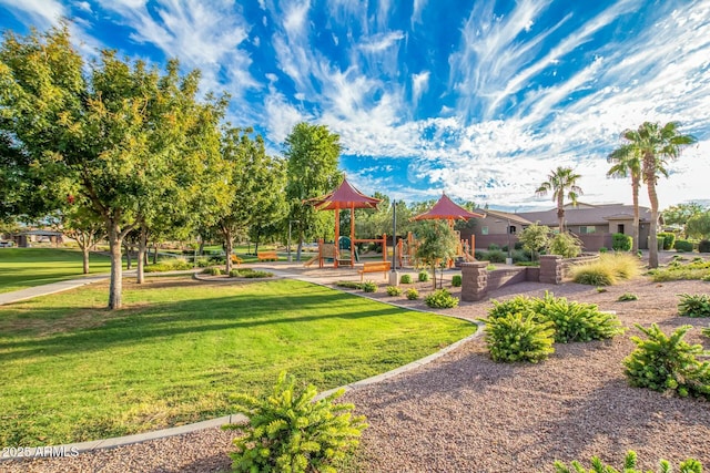 surrounding community featuring a playground and a lawn