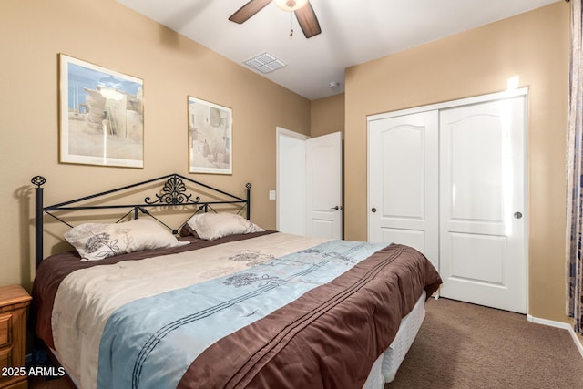 carpeted bedroom featuring a closet and ceiling fan